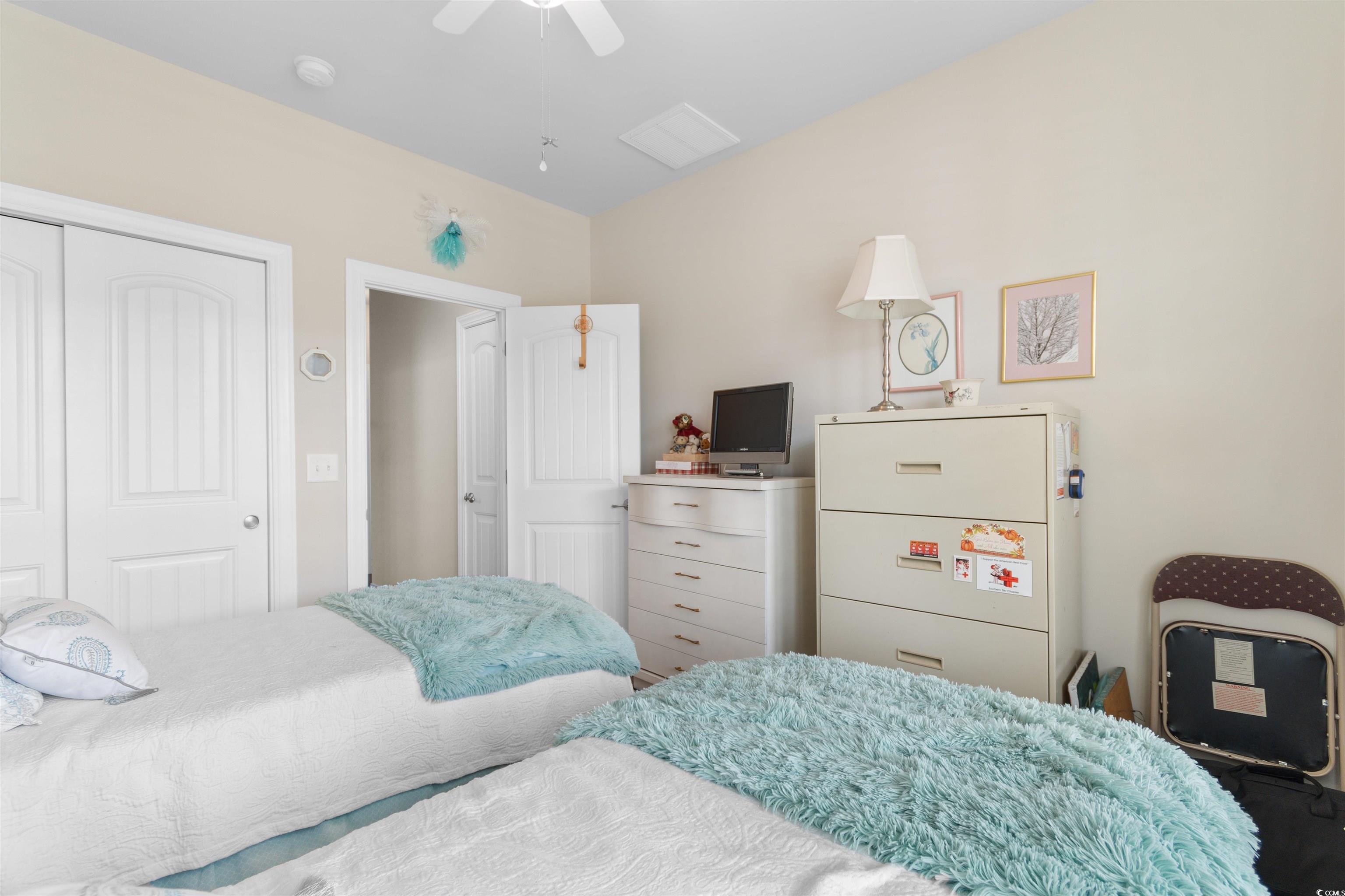 765 Berkshire Avenue Myrtle Beach, SC 29577 - Photo 25 of 40 Bedroom with a closet, ceiling fan, and vaulted ceiling