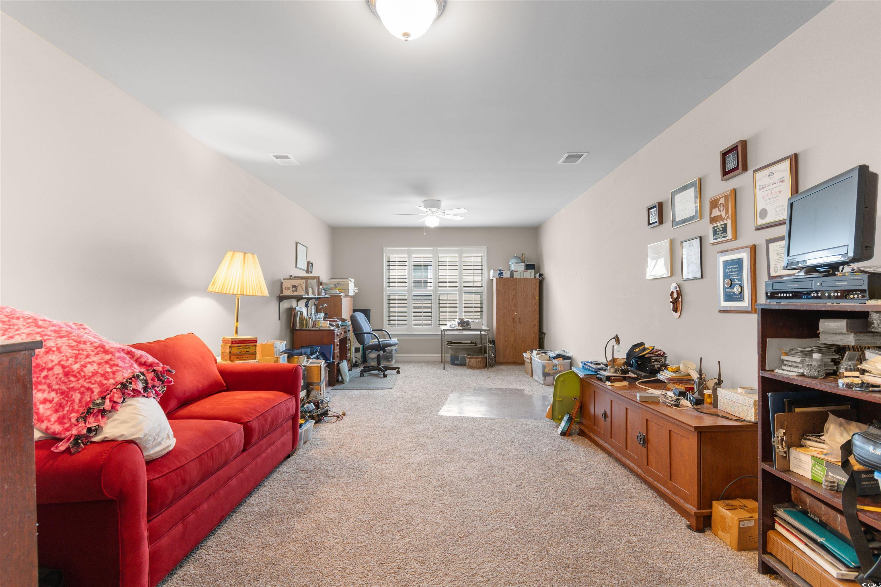 765 Berkshire Avenue Myrtle Beach, SC 29577 - Photo 28 of 40 Carpeted living room with a ceiling fan