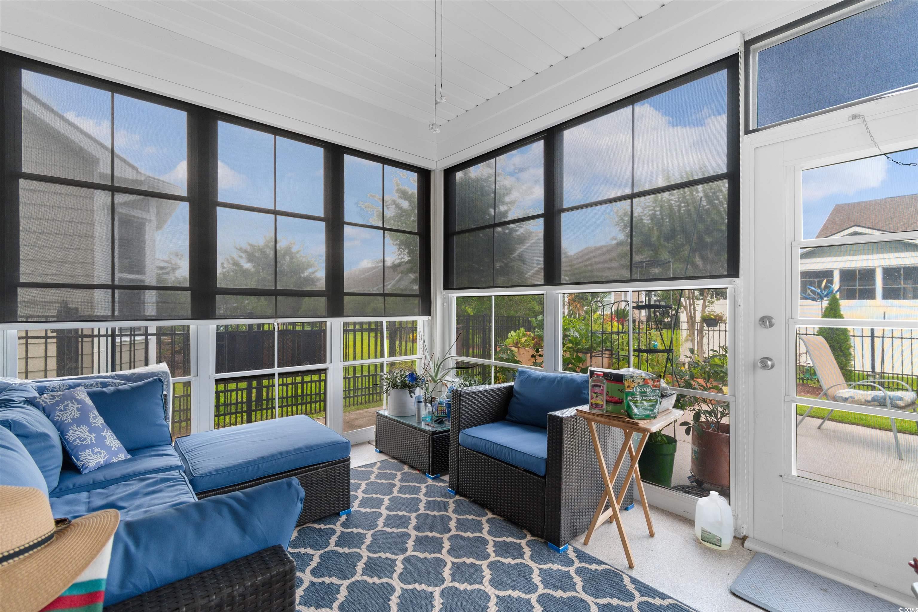 765 Berkshire Avenue Myrtle Beach, SC 29577 - Photo 32 of 40 Sunroom featuring outdoor lounge area and plenty of natural light