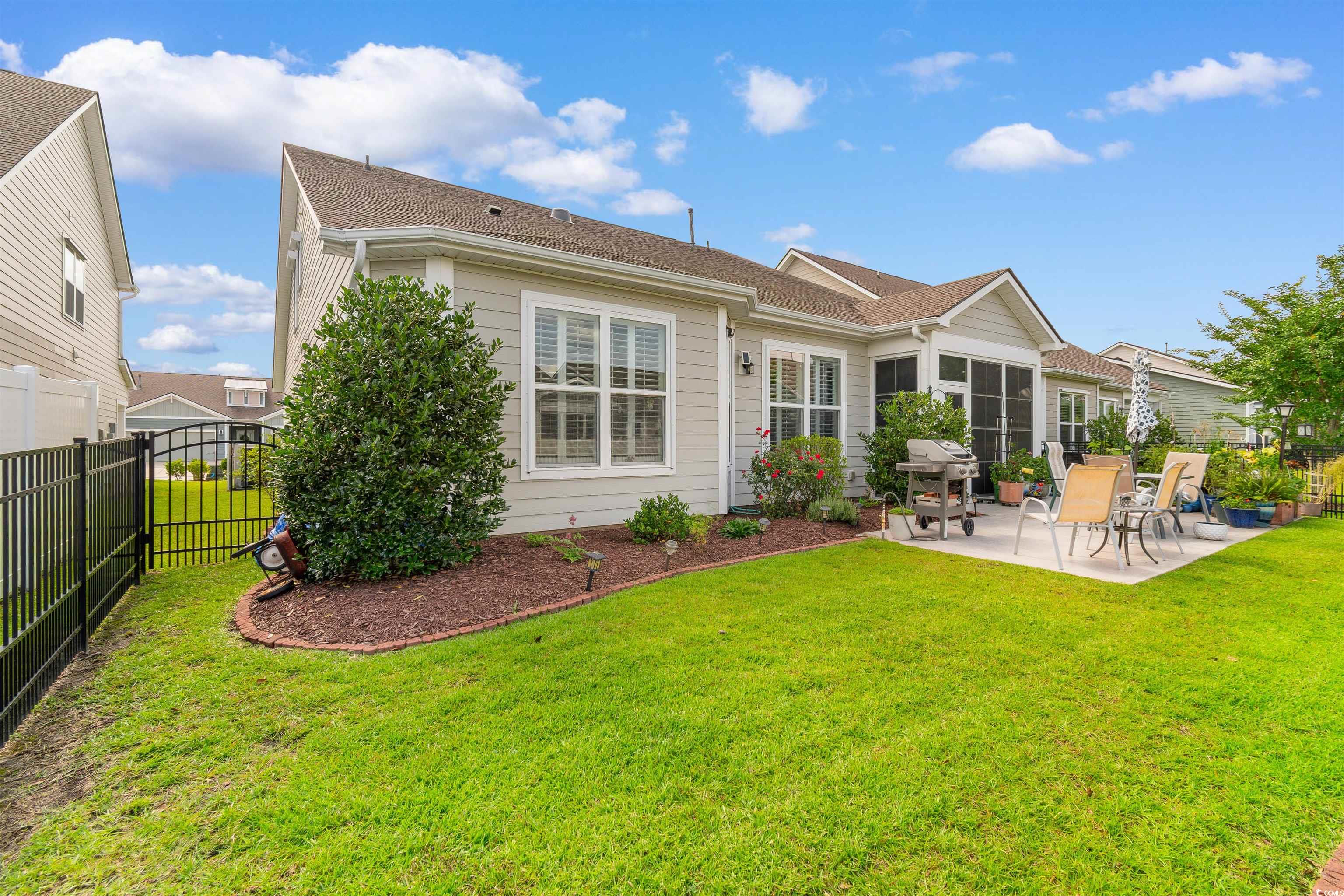 765 Berkshire Avenue Myrtle Beach, SC 29577 - Photo 34 of 40 Rear view of house featuring a patio