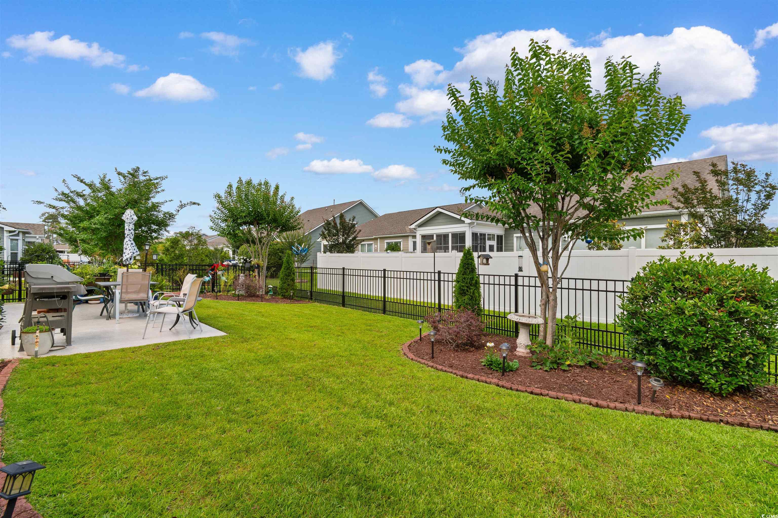 765 Berkshire Avenue Myrtle Beach, SC 29577 - Photo 35 of 40 View of yard featuring a patio