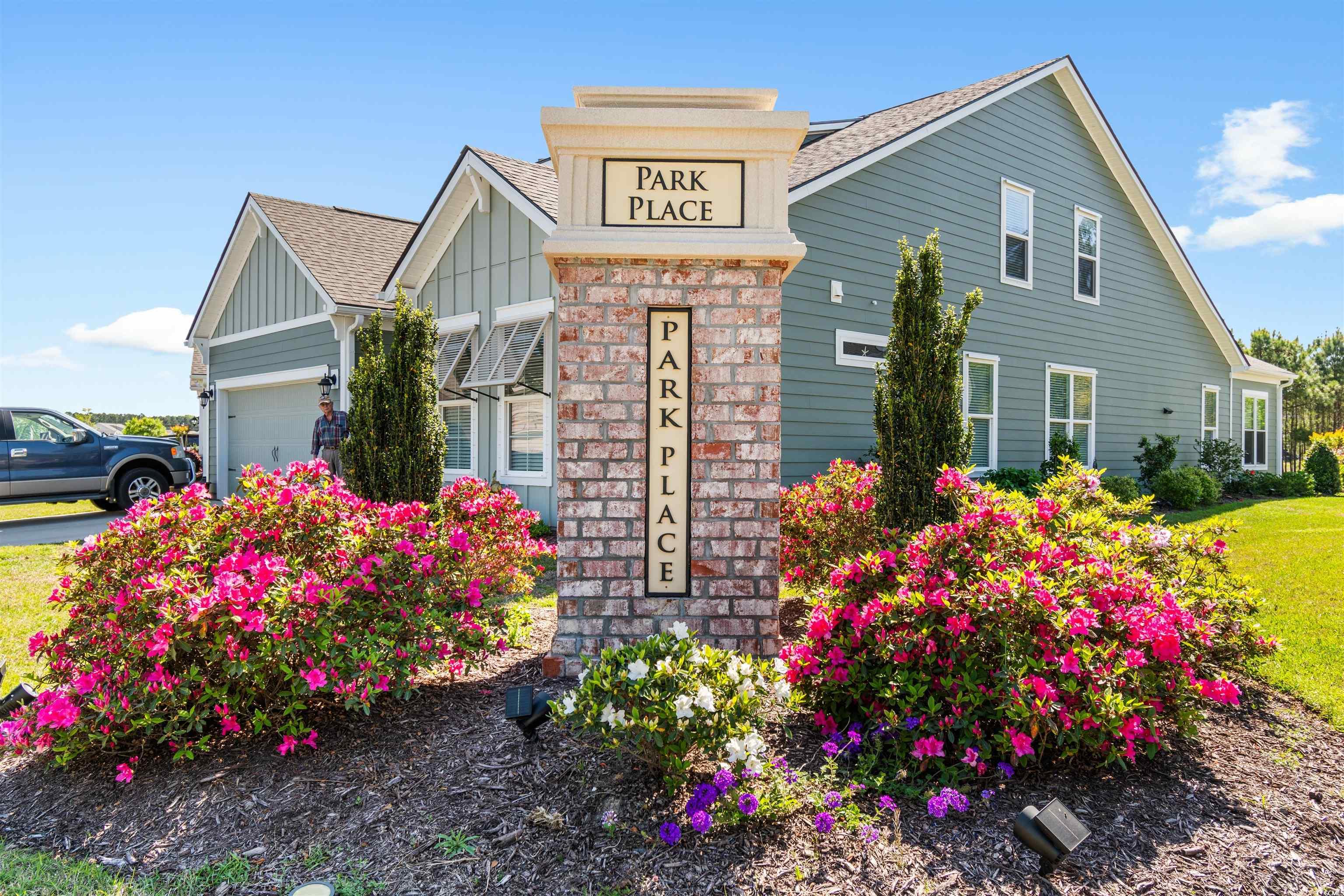 765 Berkshire Avenue Myrtle Beach, SC 29577 - Photo 40 of 40 View of front of house featuring board and batten siding, an attached garage, and a shingled roof