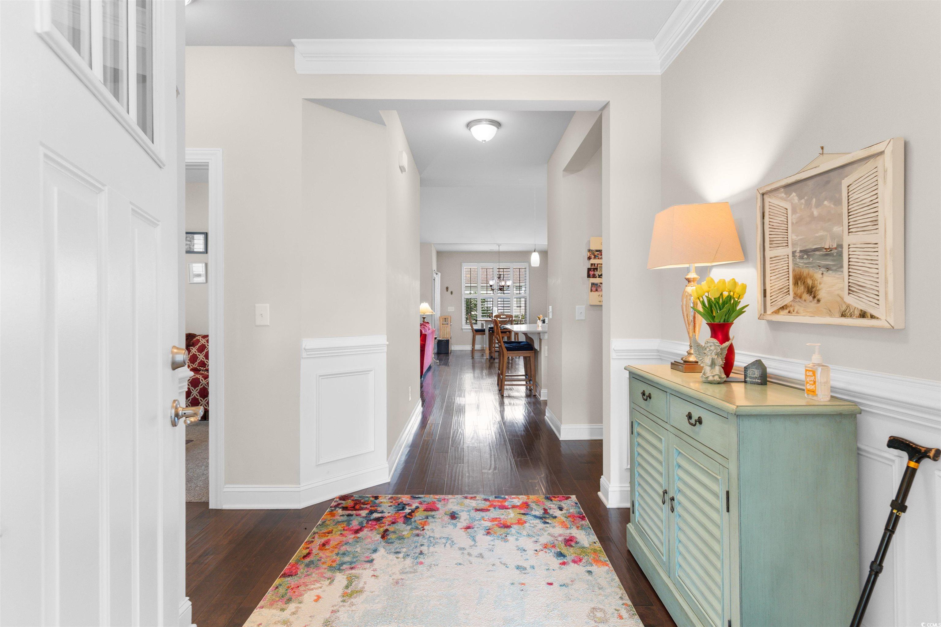 765 Berkshire Avenue Myrtle Beach, SC 29577 - Photo 4 of 40 Foyer featuring dark wood-type flooring, crown molding, and baseboards