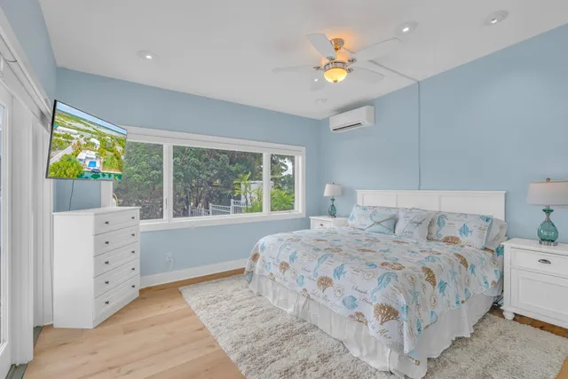 a kitchen with granite countertop a sink a stove and cabinets