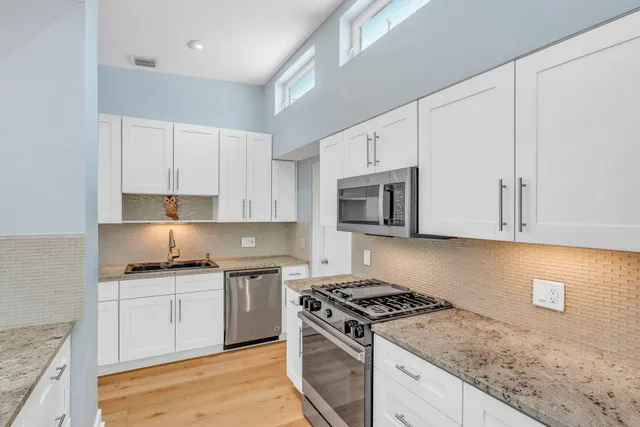 a view of a living room and dining room