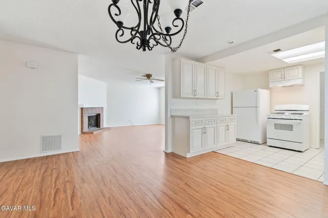 a view of a kitchen with wooden floor