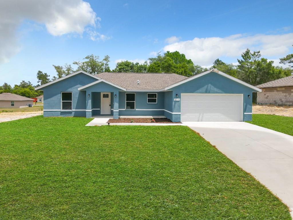 16545 Southwest 30th Ter Road Ocala, FL 34473 - Photo 1 of 1 a front view of a house with a yard