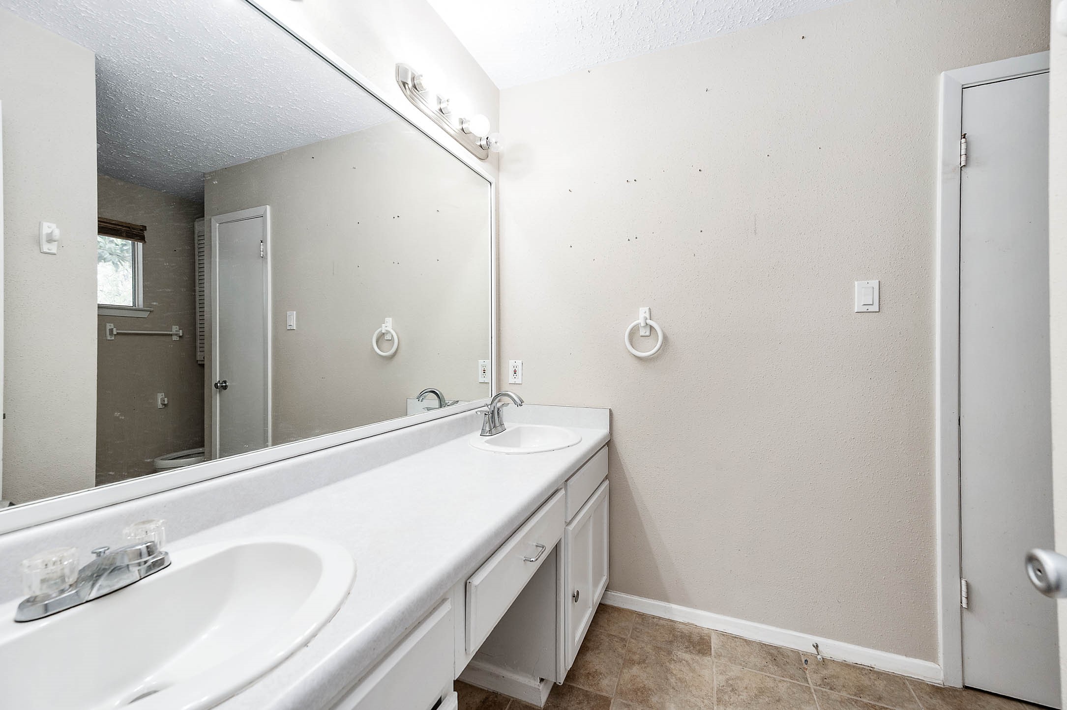 4734 Lost Lake Lane Spring, TX 77388 - Photo 16 of 23 a bathroom with a sink and a mirror