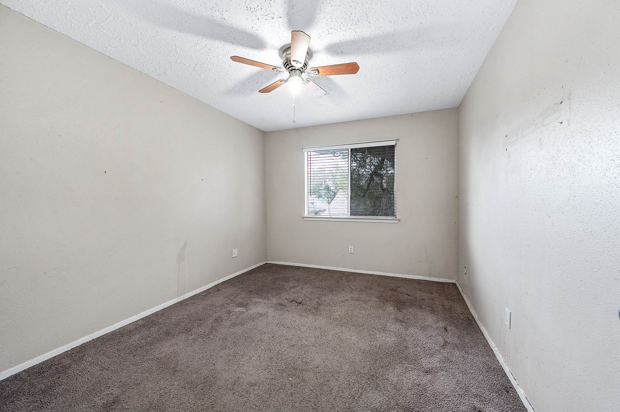 4734 Lost Lake Lane Spring, TX 77388 - Photo 17 of 23 an empty room with windows and fan