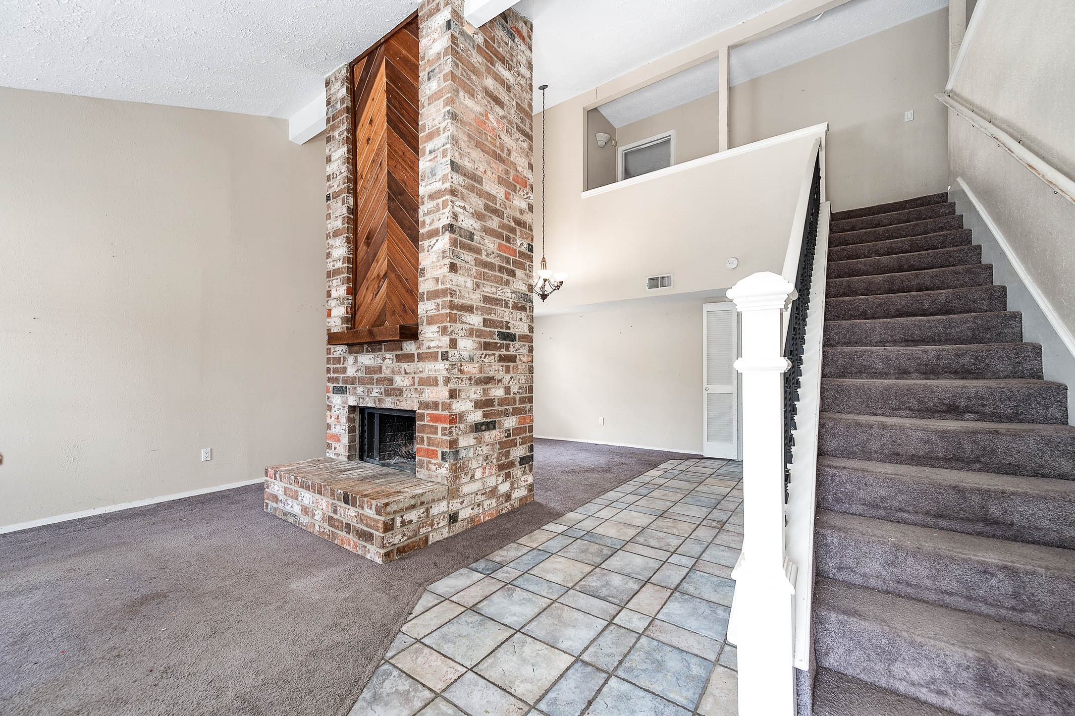 4734 Lost Lake Lane Spring, TX 77388 - Photo 2 of 23 a view of a livingroom with fireplace and stairs