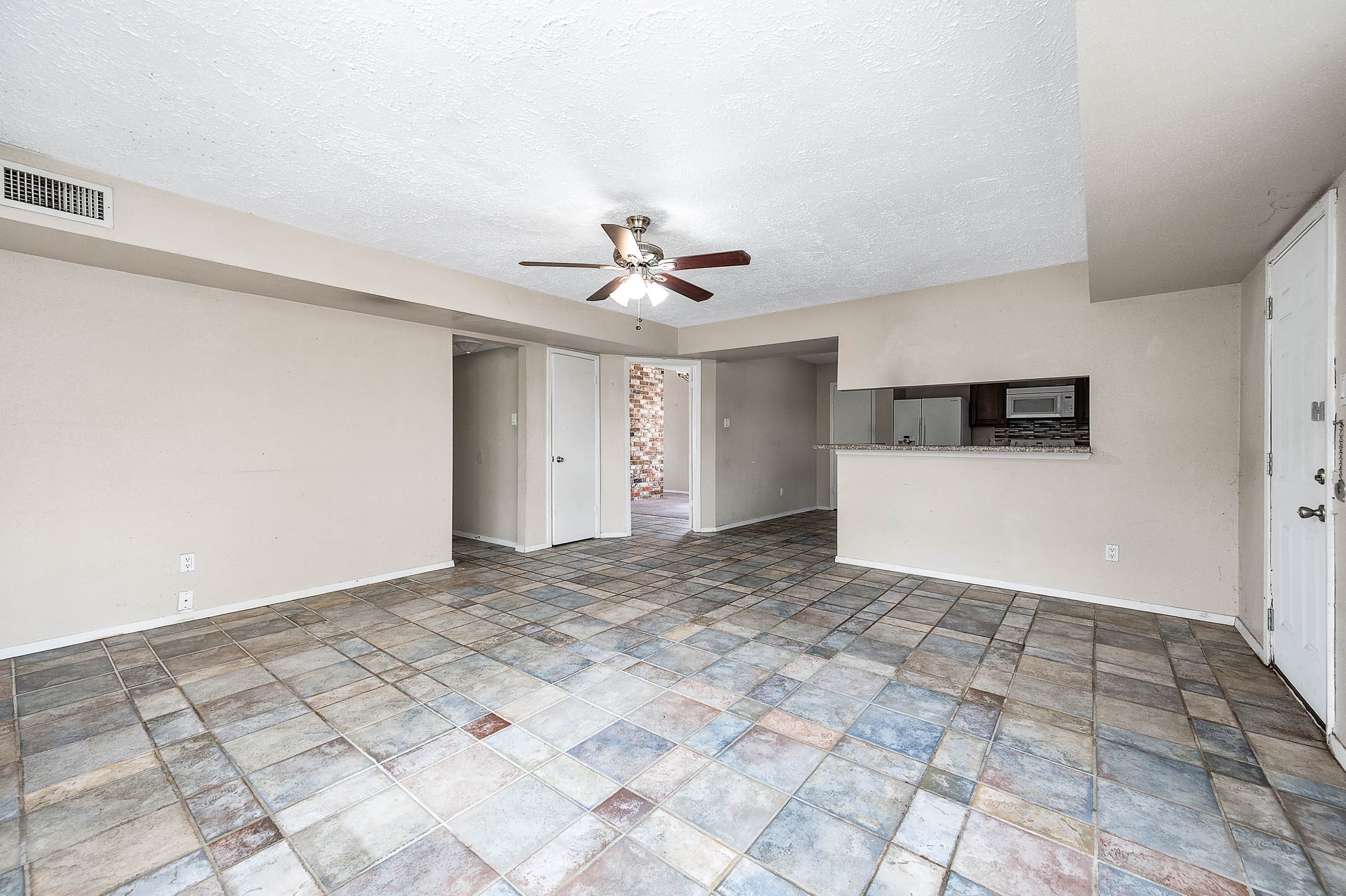 4734 Lost Lake Lane Spring, TX 77388 - Photo 8 of 23 a view of a kitchen with a sink and a refrigerator