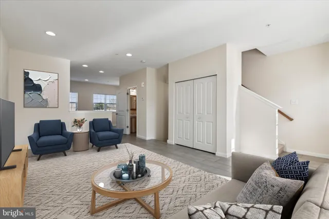 a living room with furniture and a rug