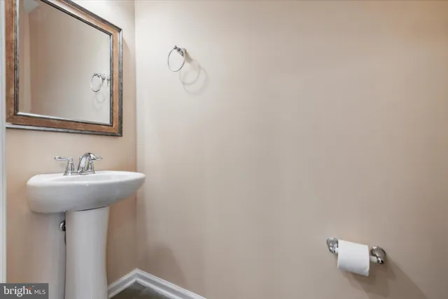 a bathroom with a sink a mirror and vanity