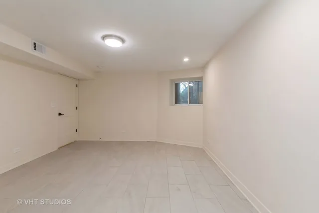 an empty room with a empty space and windows