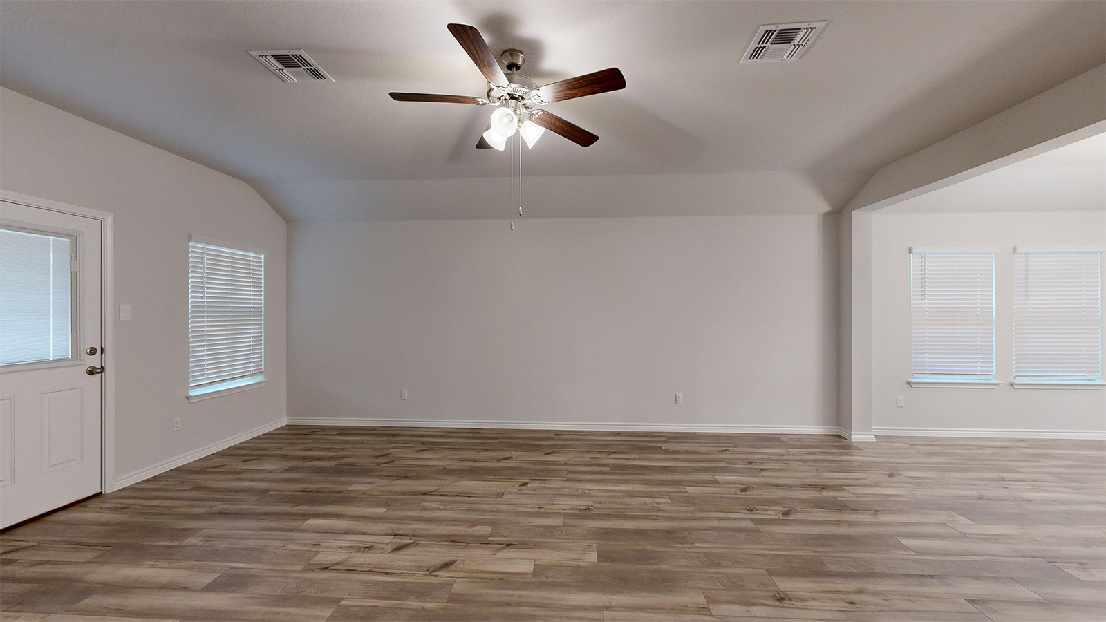 700 Gauge Road Thorndale, TX 76577 - Photo 6 of 22 Foyer entrance featuring a ceiling fan, light wood finished floors, and lofted ceiling