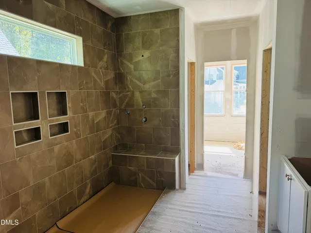 a bathroom with a sink a mirror and window