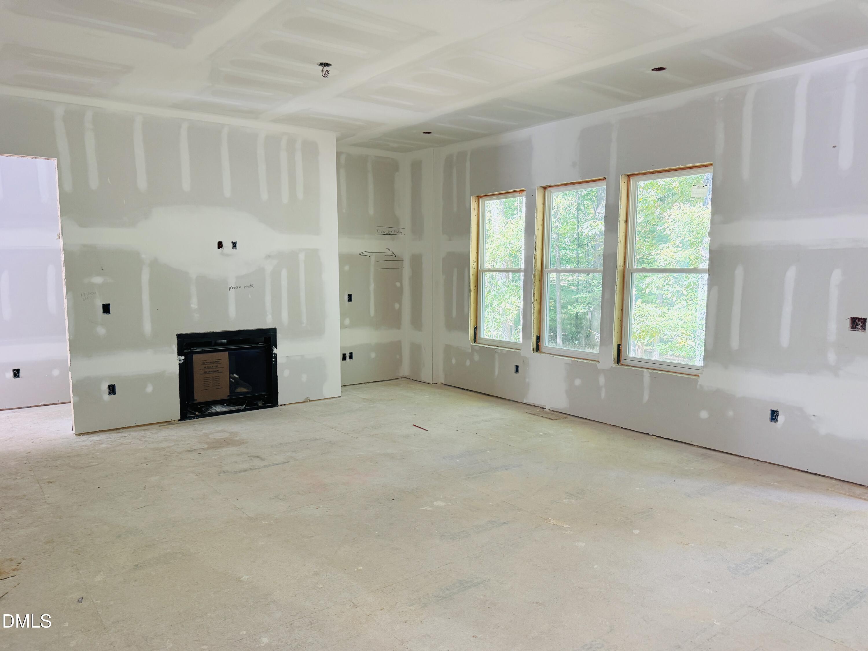 2710 Pathway Drive Chapel Hill, NC 27516 - Photo 6 of 17 a big room with windows and a fireplace