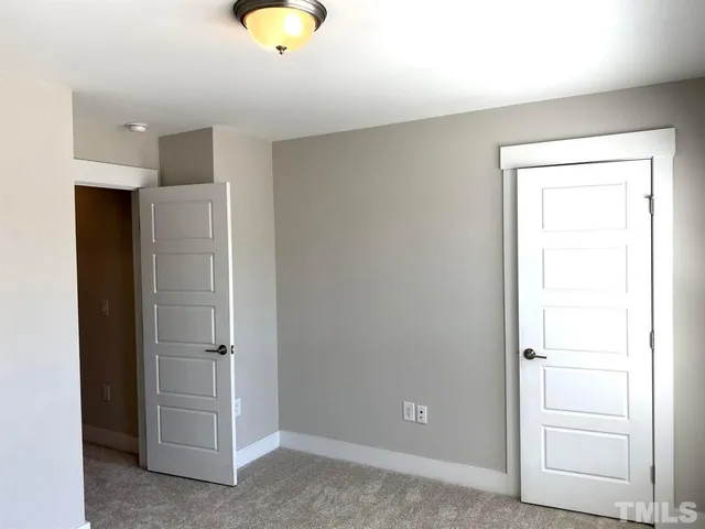 a bathroom with a shower and a mirror