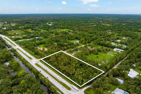 a view of a green landscape from a balcony