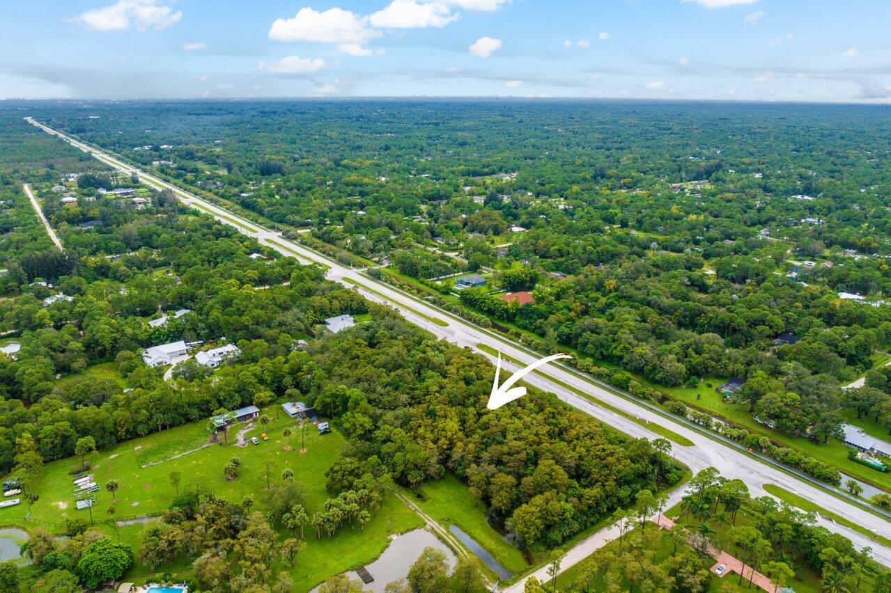 Xxxxx East Indiantown Road Jupiter, FL 33478 - Photo 9 of 9 a view of a green yard with large trees