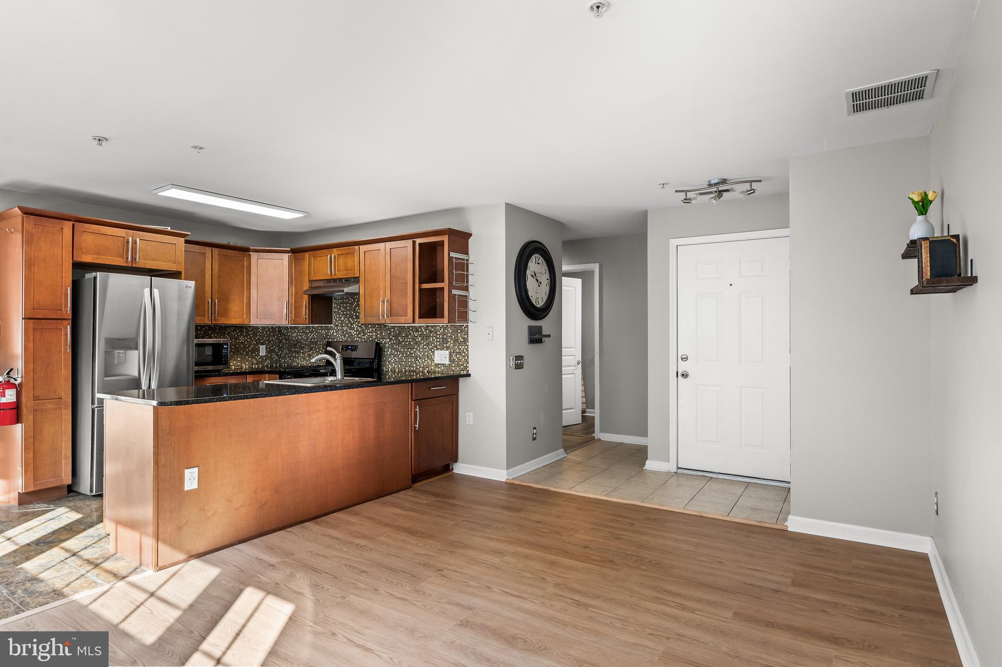 151 Wildflower Place Delran, NJ 08075 - Photo 9 of 29 a kitchen with stainless steel appliances a refrigerator and a stove top oven