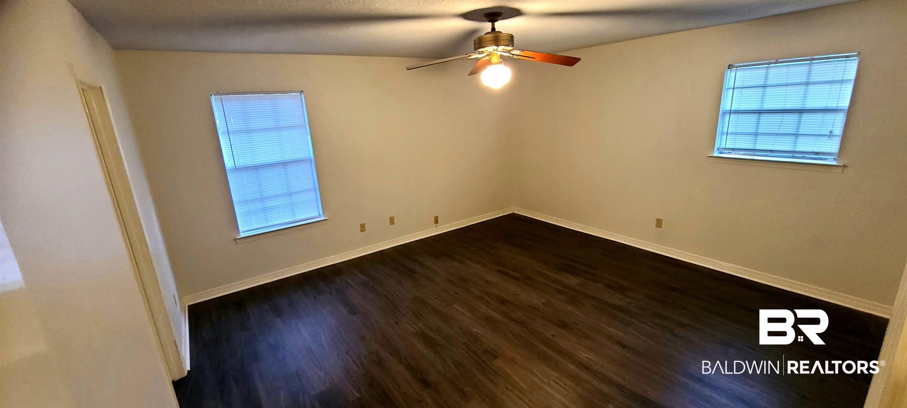 5305 Wilhelm Drive Mobile, AL 36618 - Photo 11 of 16 Spare room with ceiling fan and dark hardwood / wood-style flooring
