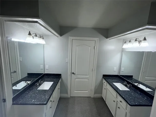 a view of a brick house with a yard