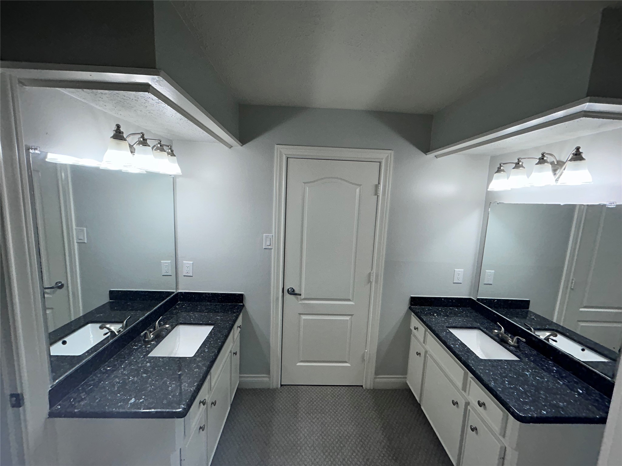 706 Houghton Road Katy, TX 77450 - Photo 12 of 14 a bathroom with a granite countertop sink and a mirror