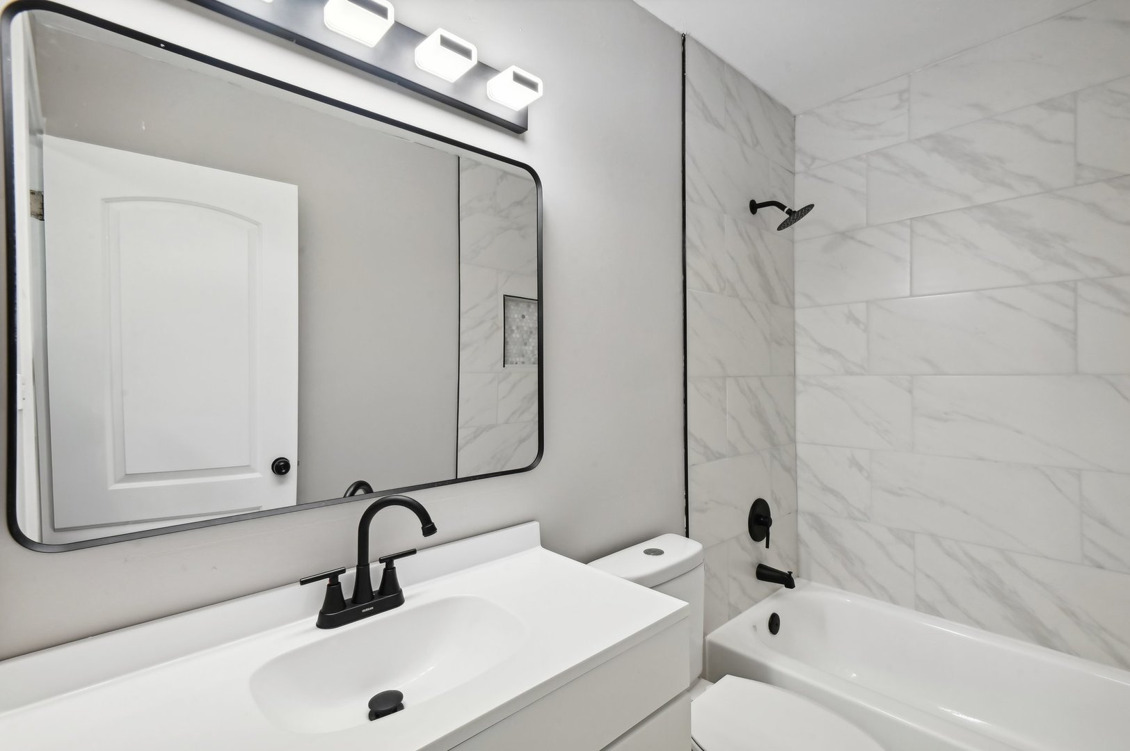 110 Elmwood Road Romeoville, IL 60446 - Photo 16 of 33 a bathroom with a sink and a mirror