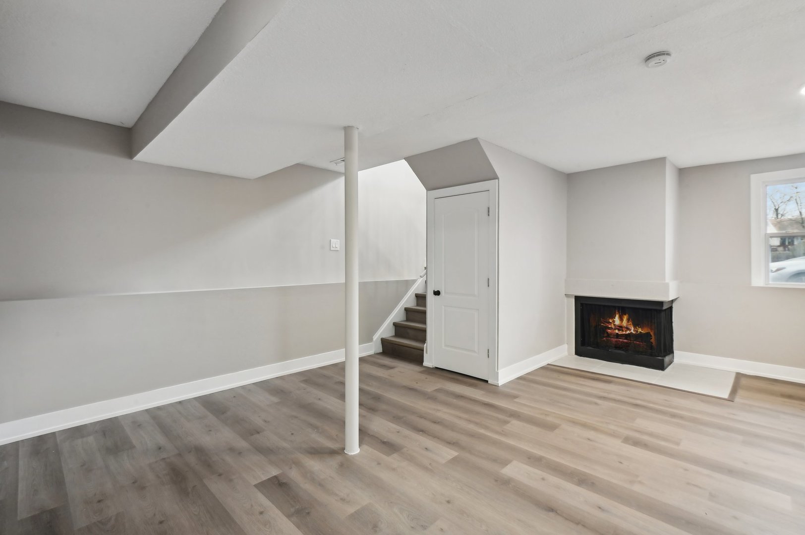 110 Elmwood Road Romeoville, IL 60446 - Photo 18 of 33 an empty room with wooden floor ceiling fan and windows