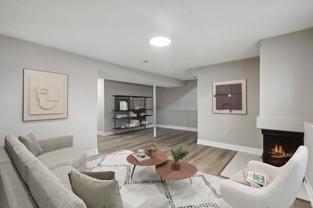 110 Elmwood Road Romeoville, IL 60446 - Photo 19 of 33 a living room with furniture and a wooden floor