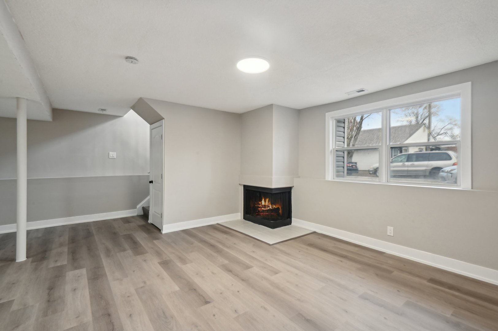 110 Elmwood Road Romeoville, IL 60446 - Photo 21 of 33 an empty room with windows and fireplace