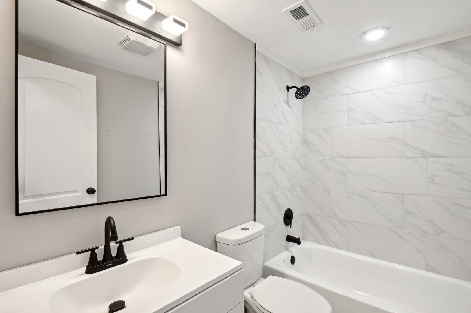 110 Elmwood Road Romeoville, IL 60446 - Photo 26 of 33 a bathroom with a sink a toilet and shower