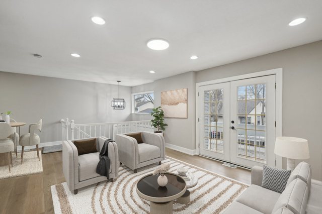 110 Elmwood Road Romeoville, IL 60446 - Photo 4 of 33 a living room with furniture and a large window