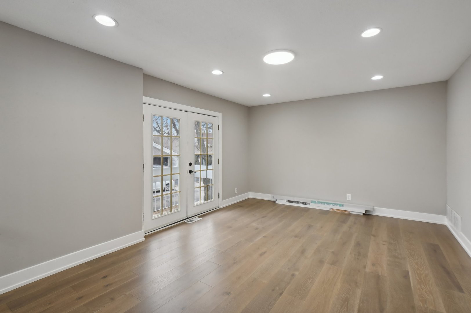 110 Elmwood Road Romeoville, IL 60446 - Photo 6 of 33 a view of an empty room with wooden floor