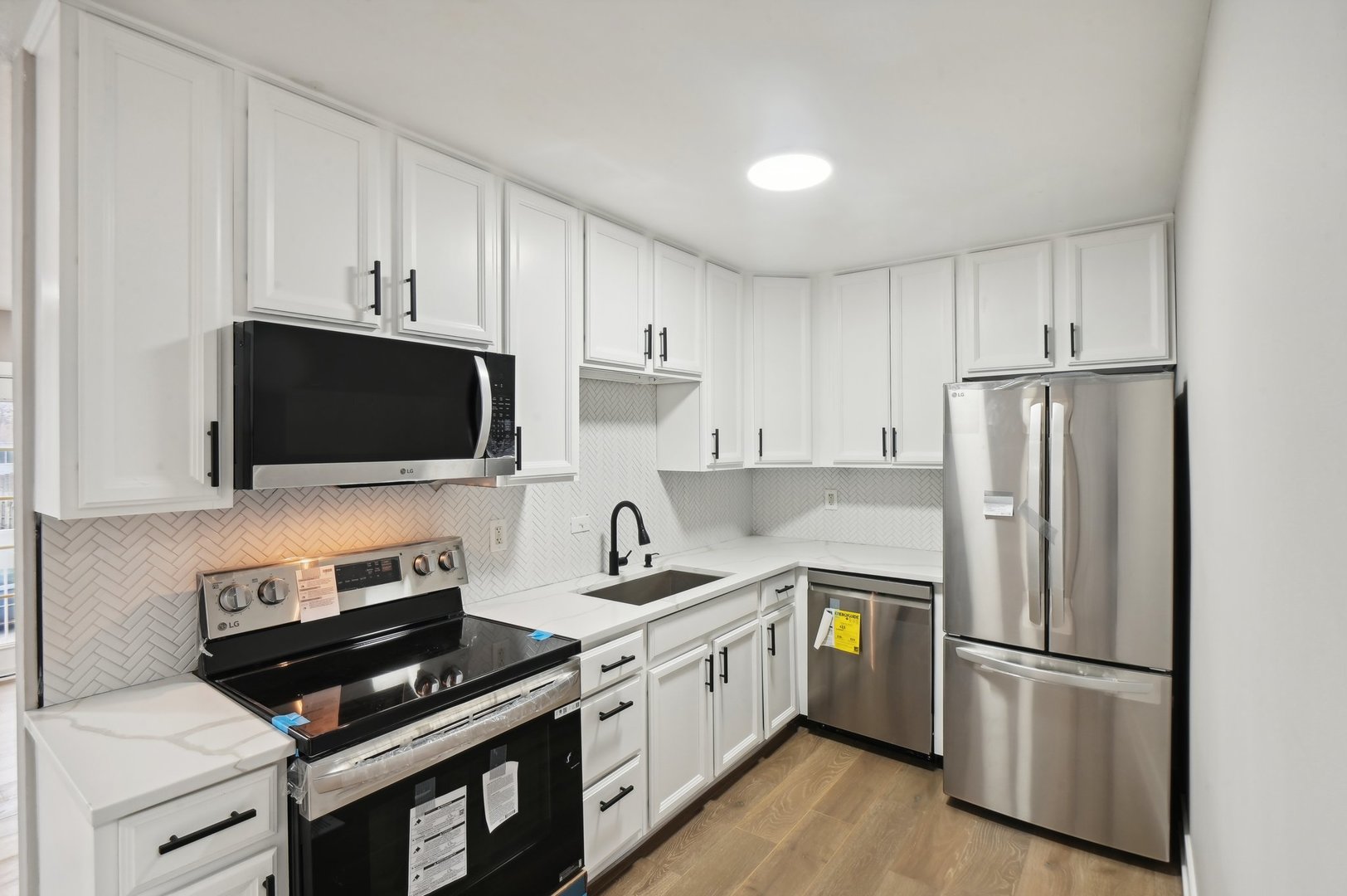110 Elmwood Road Romeoville, IL 60446 - Photo 10 of 33 a kitchen with a refrigerator stove and microwave