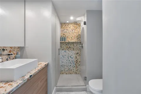 a bathroom with a bathtub and shower