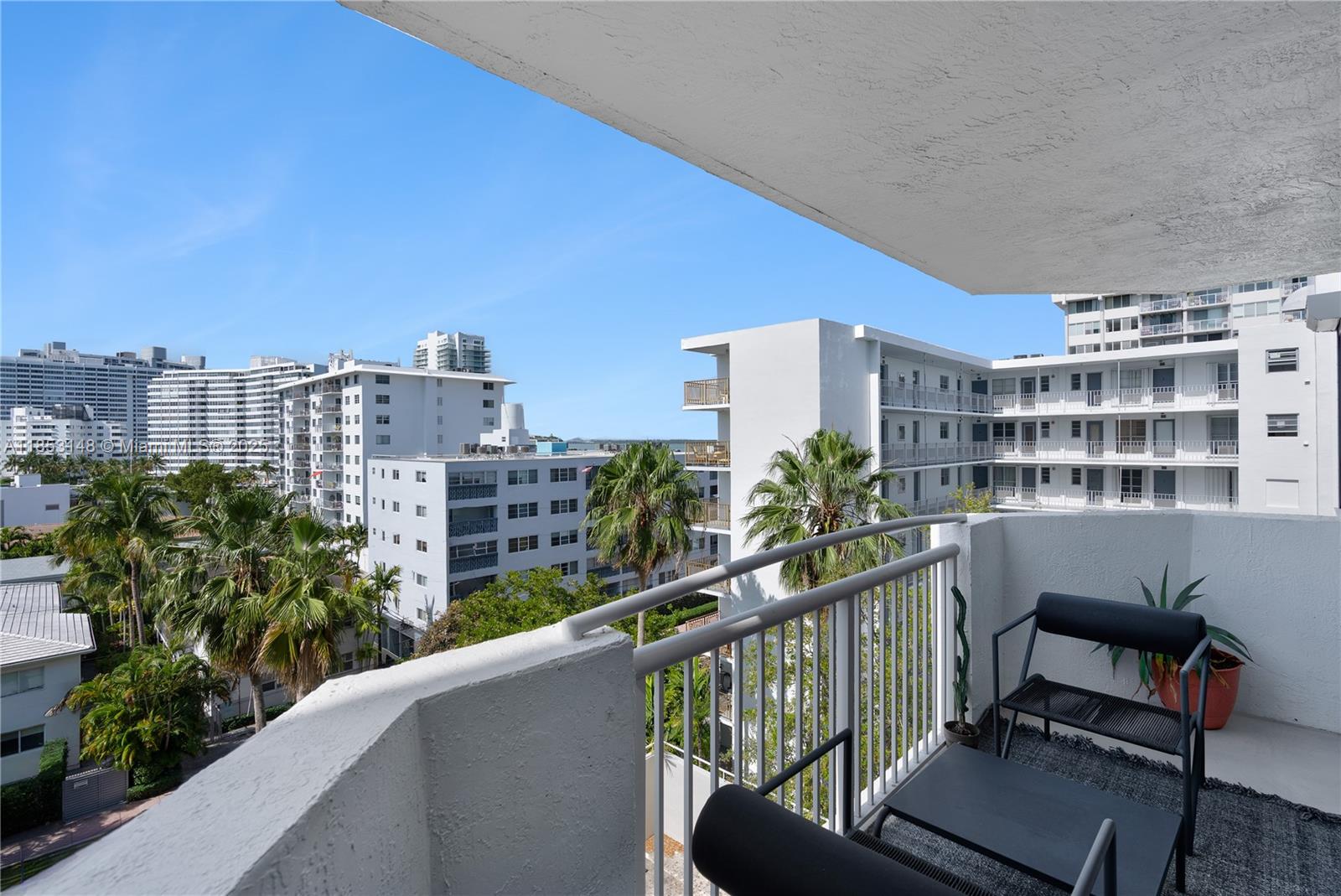 1621 Bay Road, Unit 602 Miami Beach, FL 33139 - Photo 21 of 32 a view of a balcony with chairs