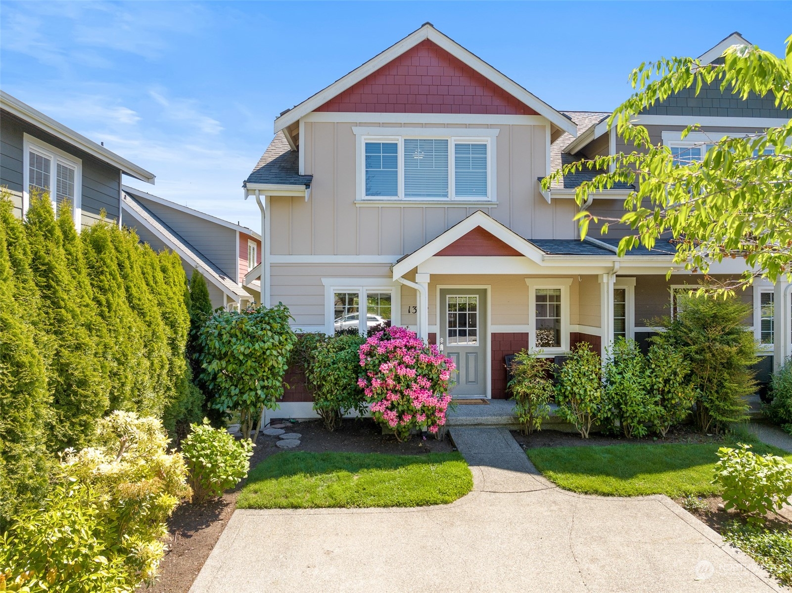 a front view of a house with garden