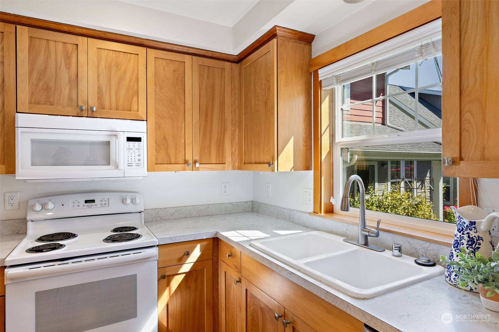 1322 Polly's Lane Bainbridge Island, WA 98110 - Photo 12 of 30 a kitchen with a sink and a stove top oven