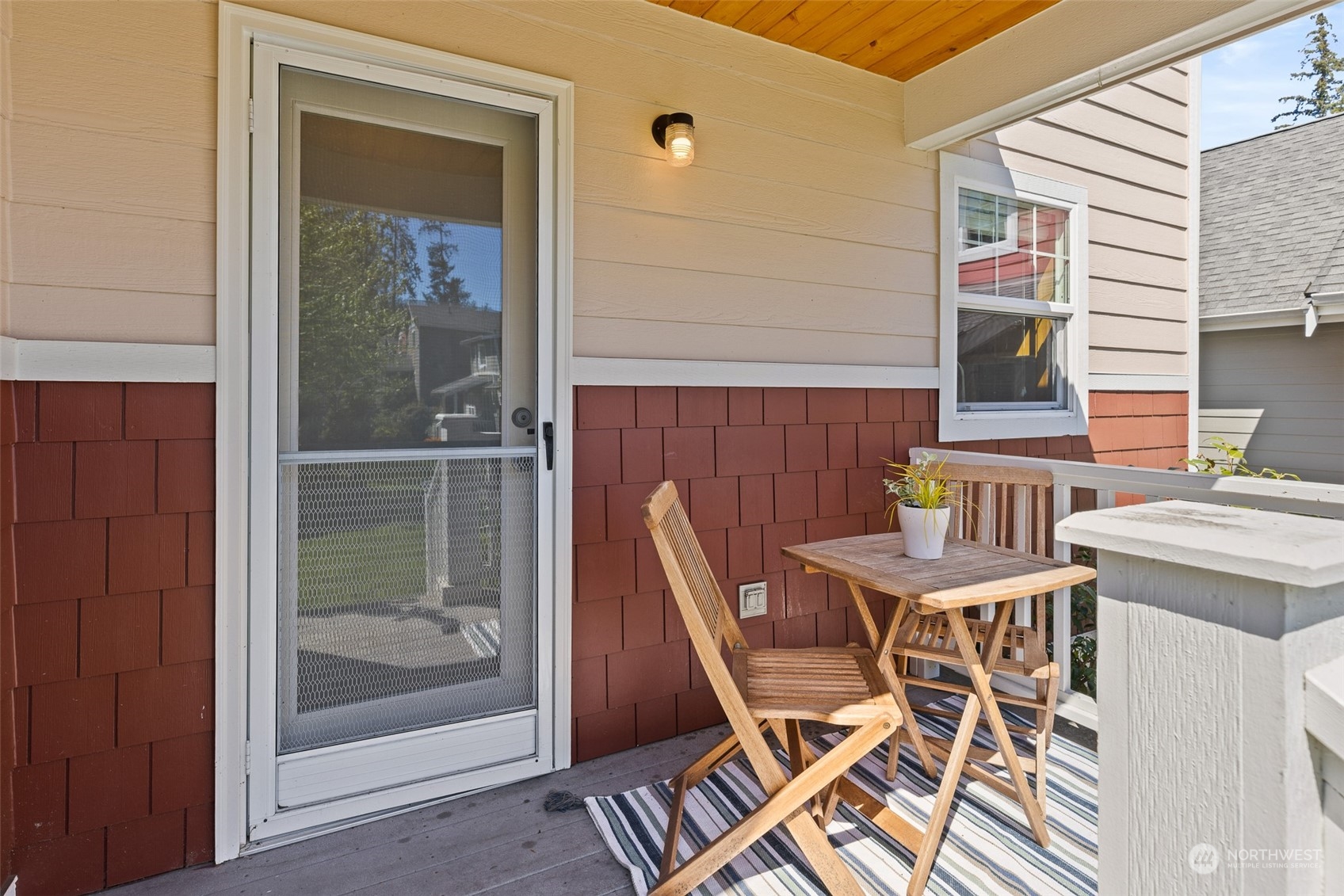 1322 Polly's Lane Bainbridge Island, WA 98110 - Photo 15 of 30 a patio with table and chairs