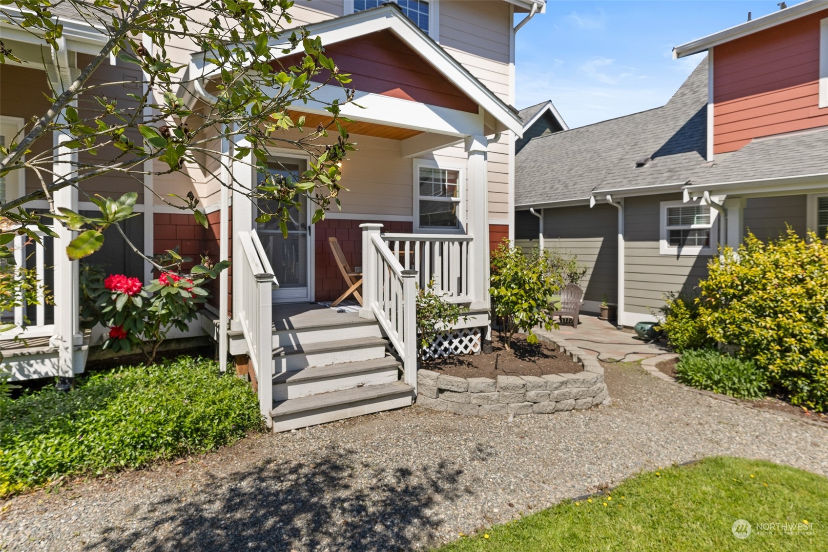 1322 Polly's Lane Bainbridge Island, WA 98110 - Photo 17 of 30 a view of a house with a yard and table and chairs in a yard