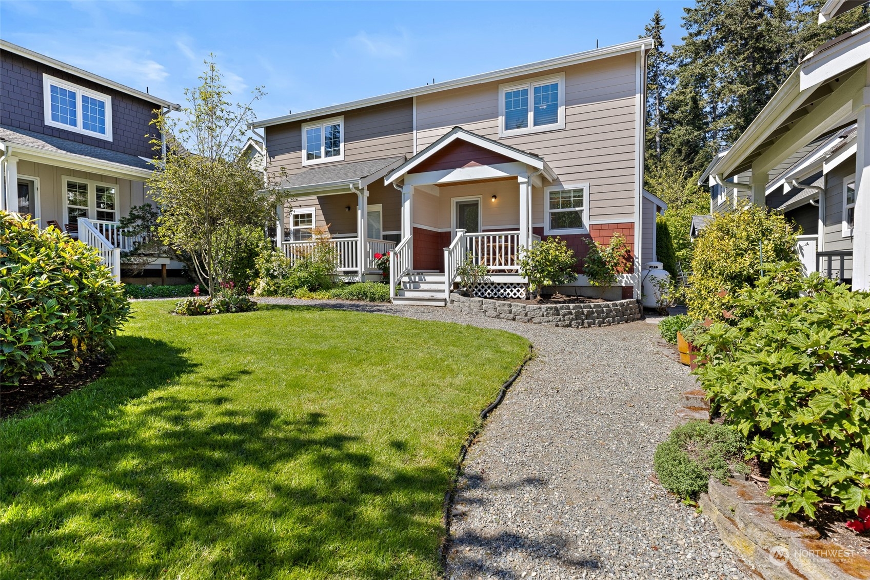 1322 Polly's Lane Bainbridge Island, WA 98110 - Photo 19 of 30 a front view of a house with yard and green space