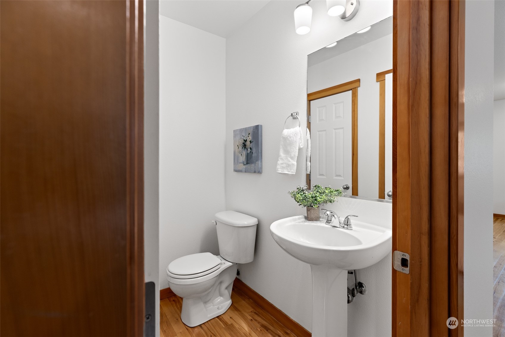 1322 Polly's Lane Bainbridge Island, WA 98110 - Photo 20 of 30 a bathroom with a toilet a sink and mirror
