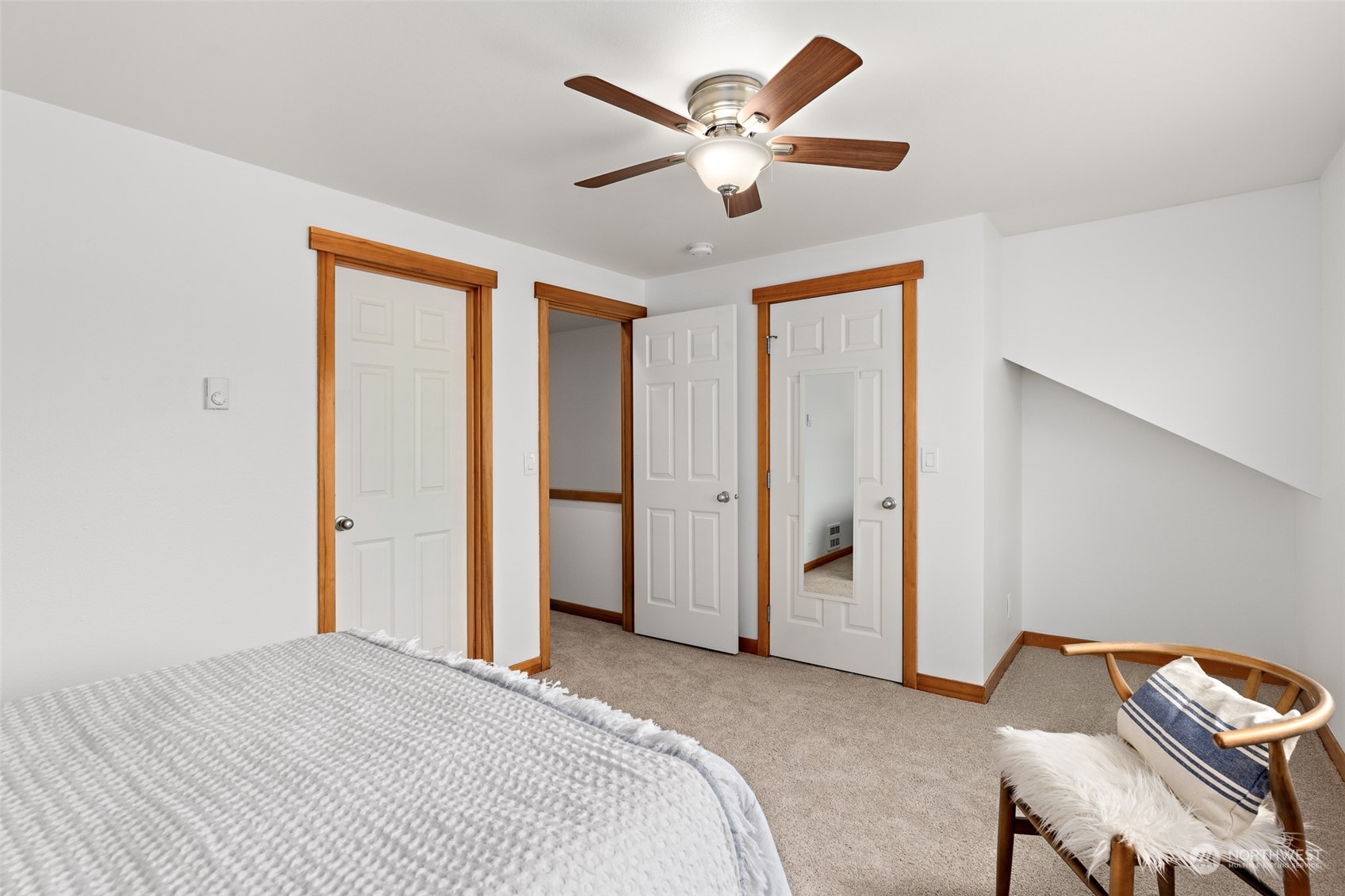 1322 Polly's Lane Bainbridge Island, WA 98110 - Photo 22 of 30 a bedroom with a bed and a chandelier