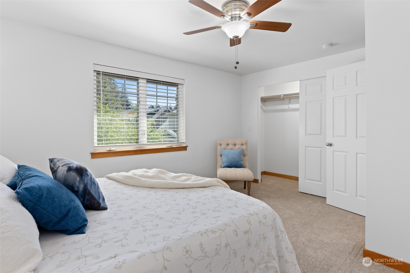 1322 Polly's Lane Bainbridge Island, WA 98110 - Photo 27 of 30 a bedroom with a large bed and a window