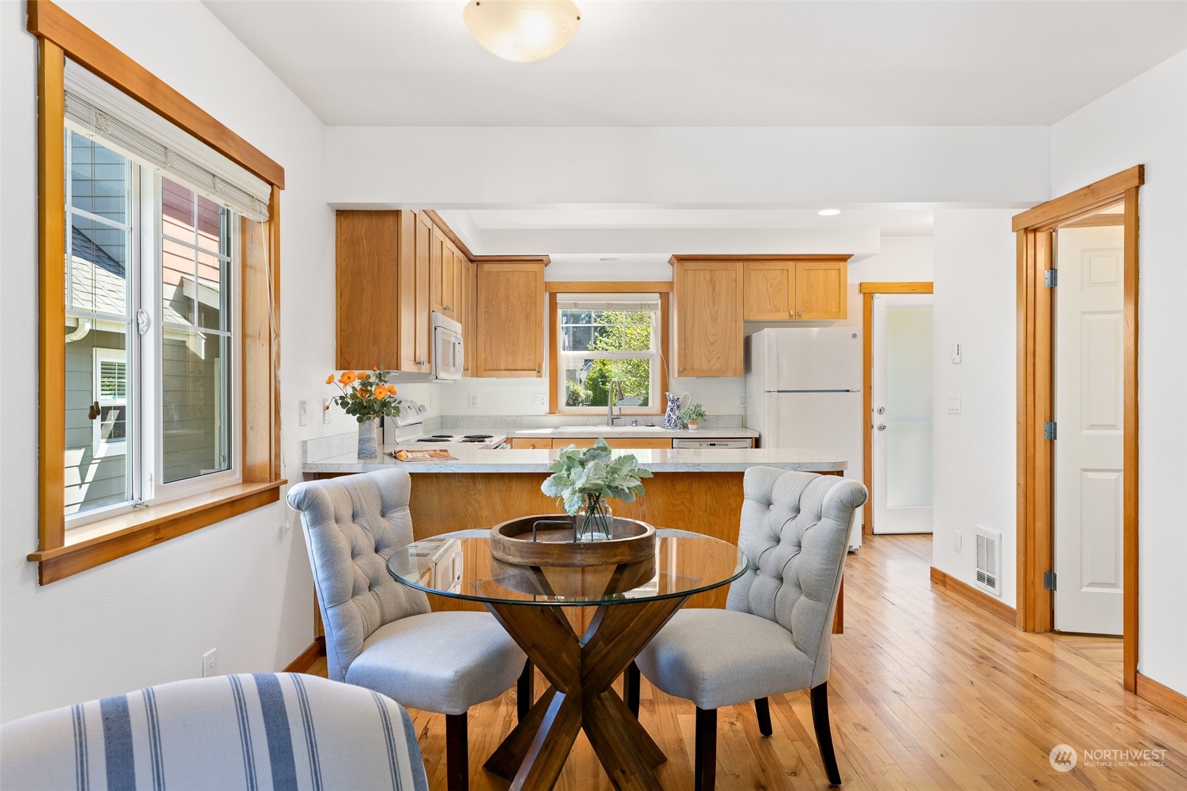 1322 Polly's Lane Bainbridge Island, WA 98110 - Photo 8 of 30 a dining room with furniture a window and wooden floor