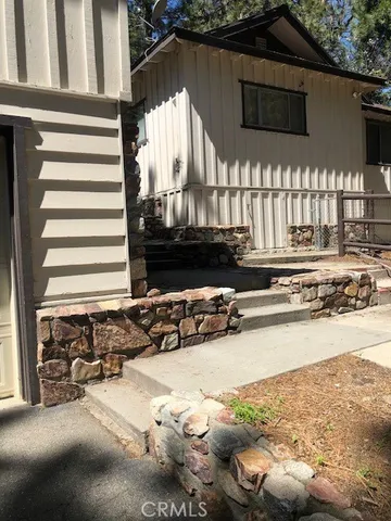a view of a hallway with wooden walls