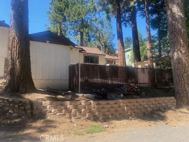 a front view of a house with a wooden fence