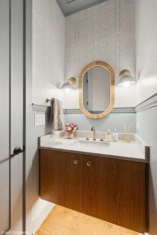 a bathroom with a sink and a mirror
